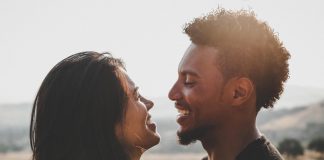 man and woman facing