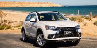 A car parked on the side of a road Description automatically generated