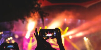 A picture containing nature, fire, lit, person Description automatically generated