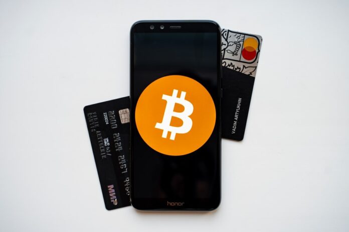 Photo by Vadim Artyukhin black android smartphone on white surface