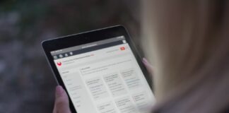 person holding black tablet computer