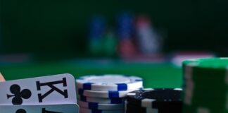 white and black dice on green table