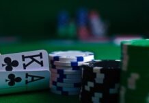 white and black dice on green table