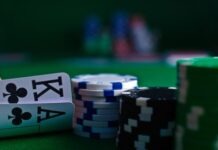 white and black dice on green table