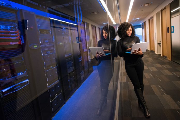Photo by Christina @ wocintechchat.com woman in black top using Surface laptop
