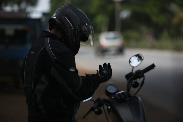Photo by Shajan Jacob selective focus photo of man wearing motorcycle suit