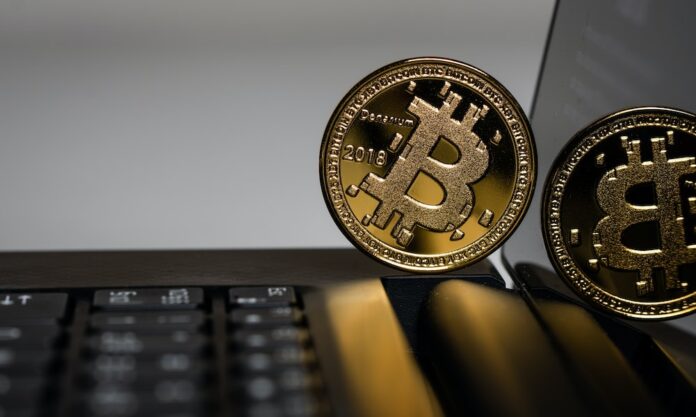 Photo by Aleksi Räisä two gold Bitcoins