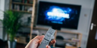 person holding gray remote control
