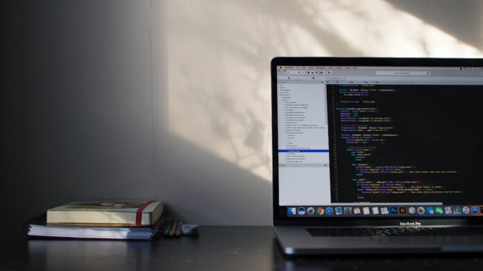 Photo by Emile Perron MacBook Pro showing programming language