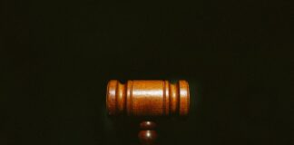 brown wooden stand with black background