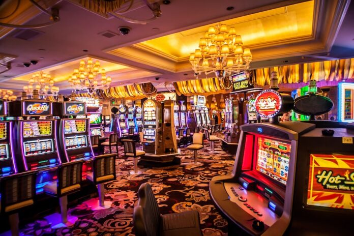 Photo by Kvnga arcade machine with lights turned on inside room