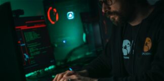 man in black jacket using computer