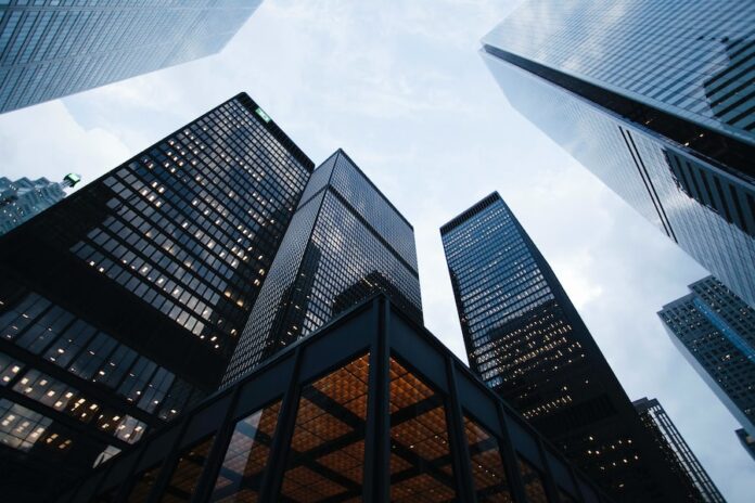 Photo by Sean Pollock low angle photo of city high rise buildings during daytime