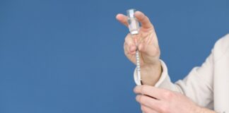 A Person Holding a Syringe