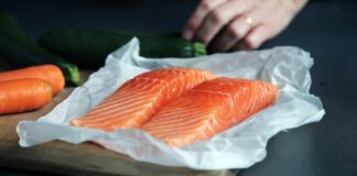 raw fish meat on brown chopping board