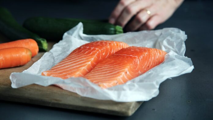 Photo by CA Creative raw fish meat on brown chopping board