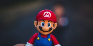 super mario in blue and red shirt figurine