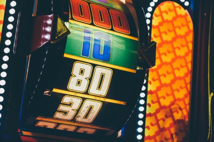 Photo by Krissia Cruz lighted slot machine at nighttime