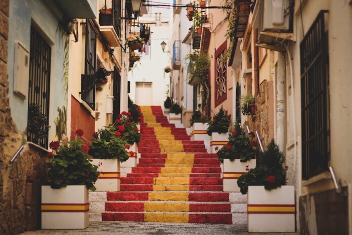 Photo by Sam Williams red, yellow, and white concrete stairs