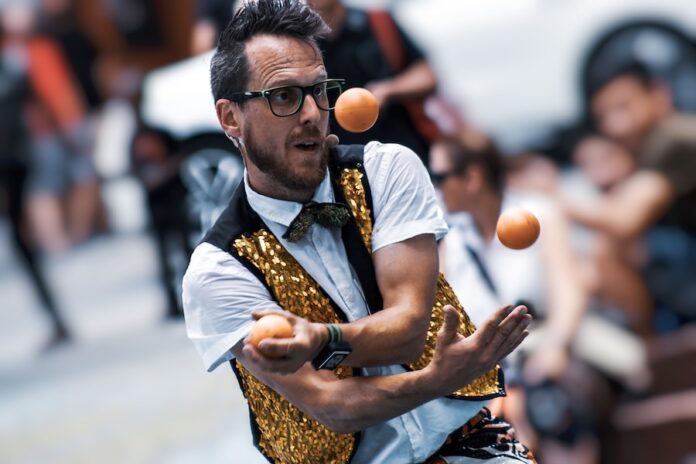 Photo by Yi Liu selected focus photogrpahy of man playing balls