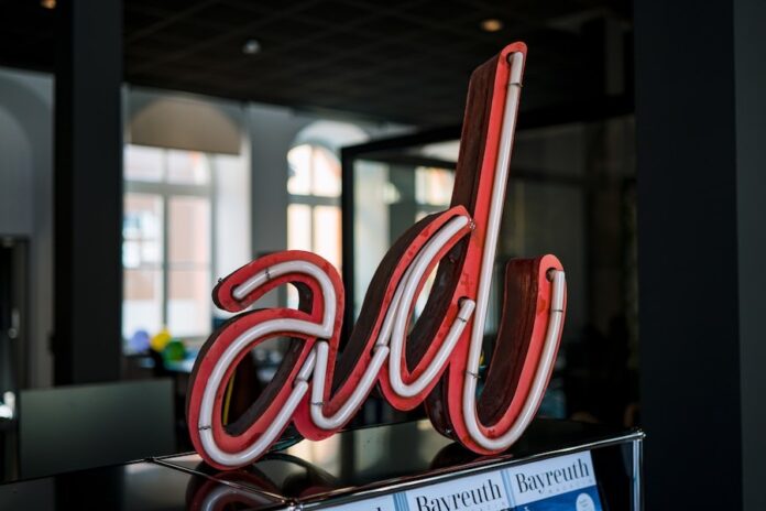 Photo by Julian Hochgesang red and white love neon light signage