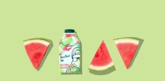 green and white labeled bottle beside sliced watermelon