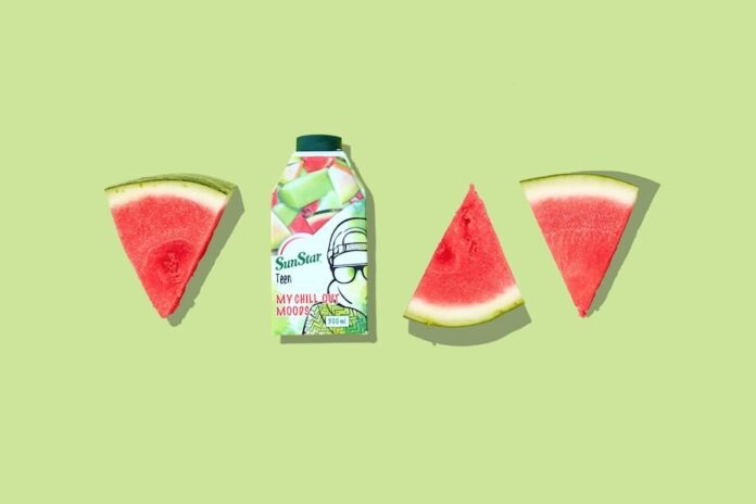 Photo by Mahbod Akhzami green and white labeled bottle beside sliced watermelon