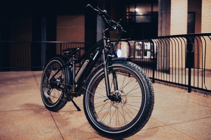Photo by Erik Mclean Bicycle on a Concrete Pavement