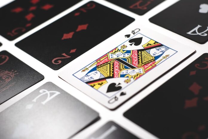 Photo by Esteban López queen of spade playing card