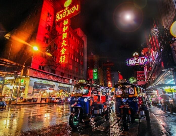 Photo by Florian Wehde two auto rickshaw on the street