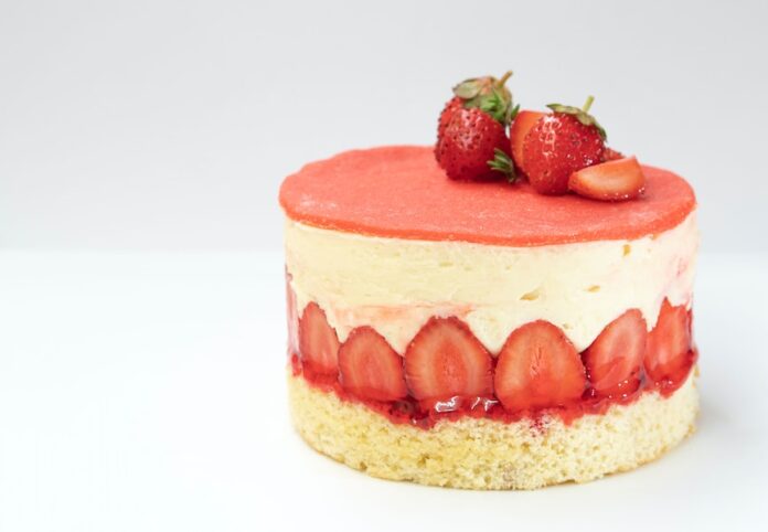 Photo by amirali mirhashemian strawberry cake on white surface
