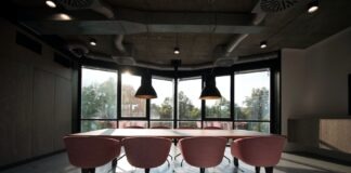 pink dining table with four chairs inside room