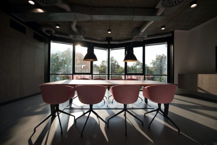 Photo by Nastuh Abootalebi pink dining table with four chairs inside room