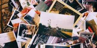 a pile of old photos and postcards sitting on top of each other