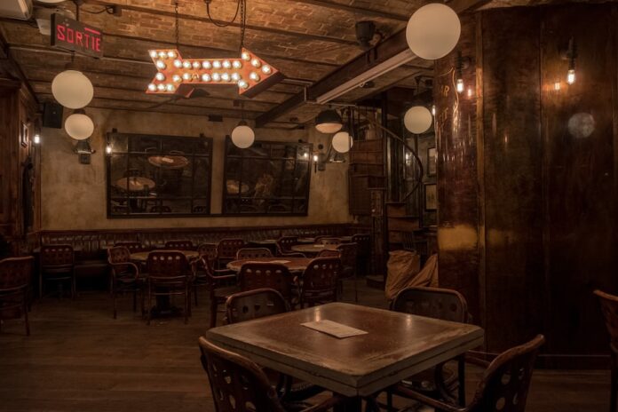 Photo by Nicolas Hoizey square of brown wooden table