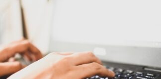 person using black computer keyboard