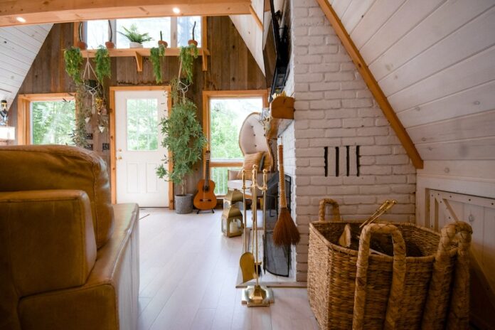 Photo by Andrea Davis brown wooden acoustic guitar near brown wicker armchair