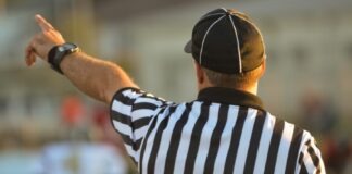 man pointing his finger during daytime