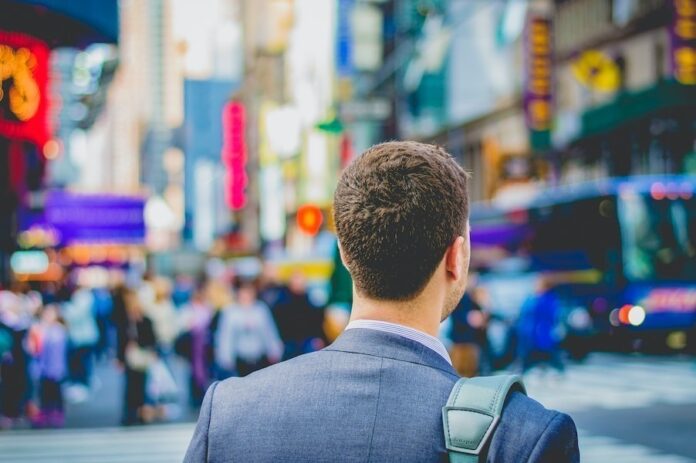 Photo by Saulo Mohana shallow focus photography of man in suit jacket's back