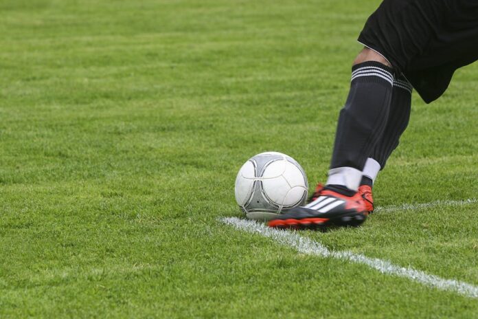 Photo by Pixabay Soccer Player Kicking White Gray Soccer Ball on Green Grass Field