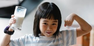 Asian girl with milk on lips