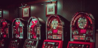 A row of slot machines Description automatically generated