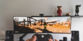 person holding black game controller