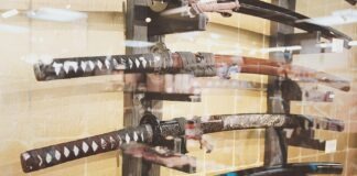 Mastering the Blade: A Comprehensive Guide to Understanding the Katana a display of different types of knives in a glass case
