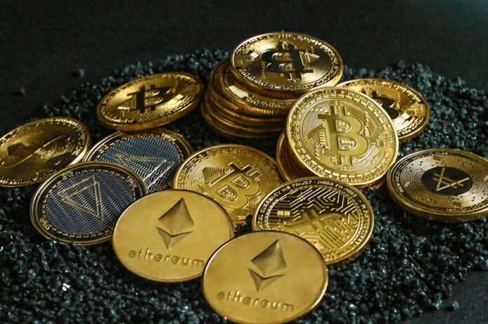 Photo by Traxer a pile of bitcoins sitting on top of a pile of gravel
