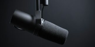 black and silver microphone with white background