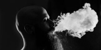 man smoking with black background