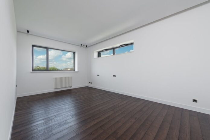 Spacious empty room with white walls