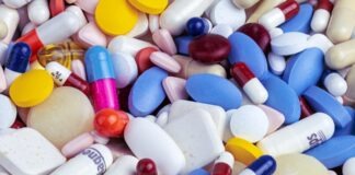 white blue and orange medication pill