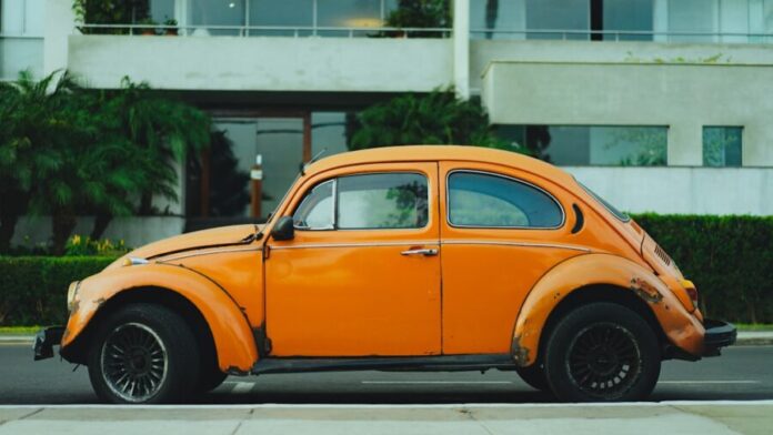 Photo by Dan Gold shallow focus photography of orange Volkswagen Beetle